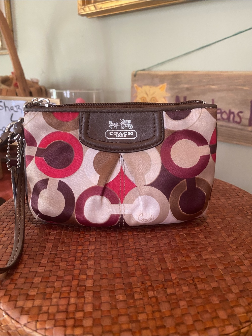 Coach Madison Graphic Op Art wristlet with Signature C’s & Brown Leather Trim